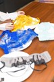 A table topped with plates filled with different types of lingerie.